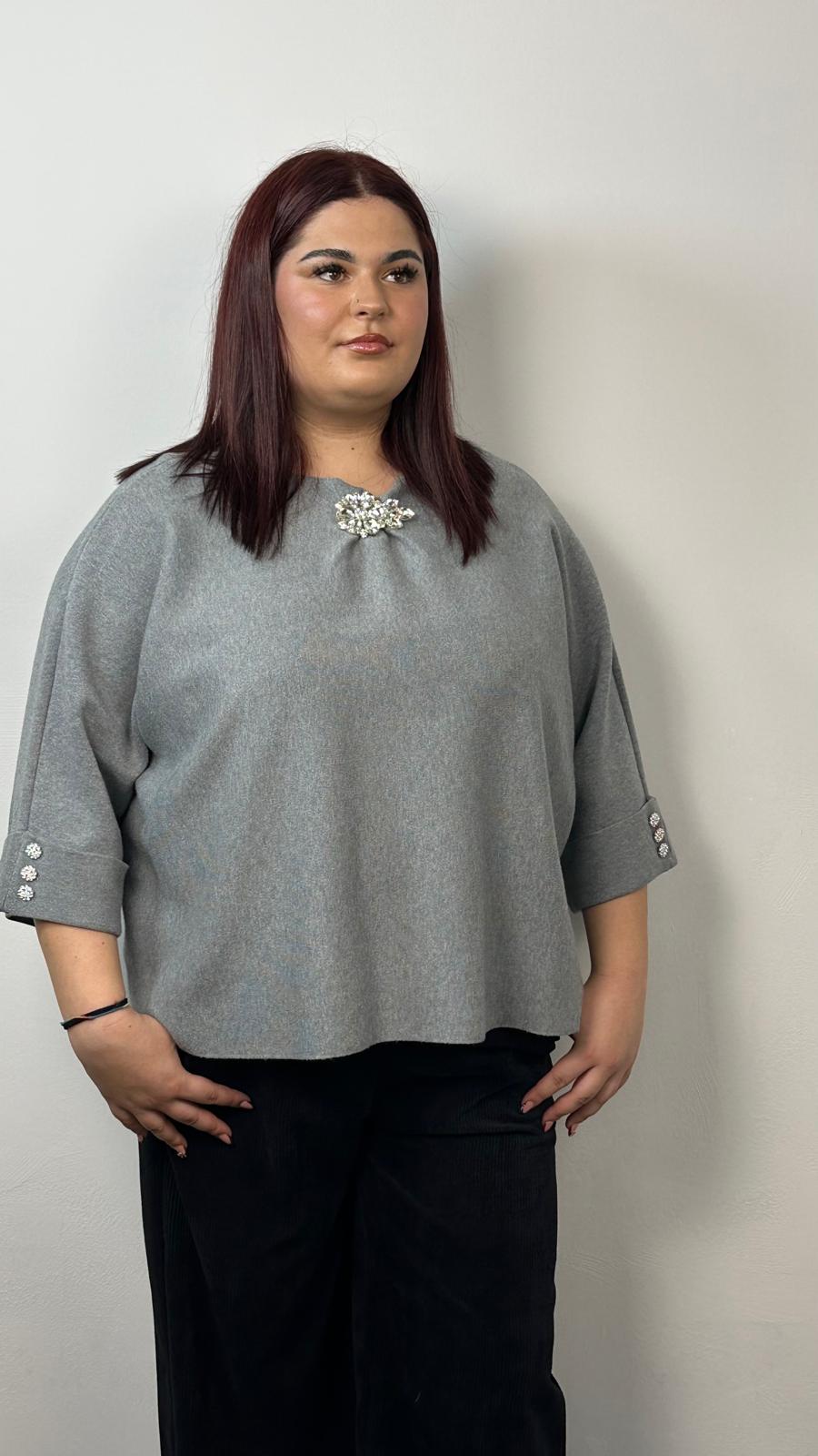 Maglia con spilla gioiello